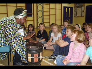little kid playing drums