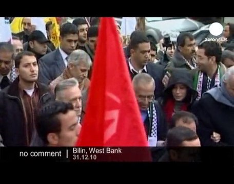 Protesters march against separation barrier... - no comment