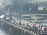 Egyptian praying protesters being attacked on BRIDGE
