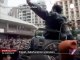 The crowd carries a man in a wheel chair in... - no comment