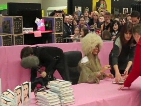 Katie Price wears furry hat for Asda book signing