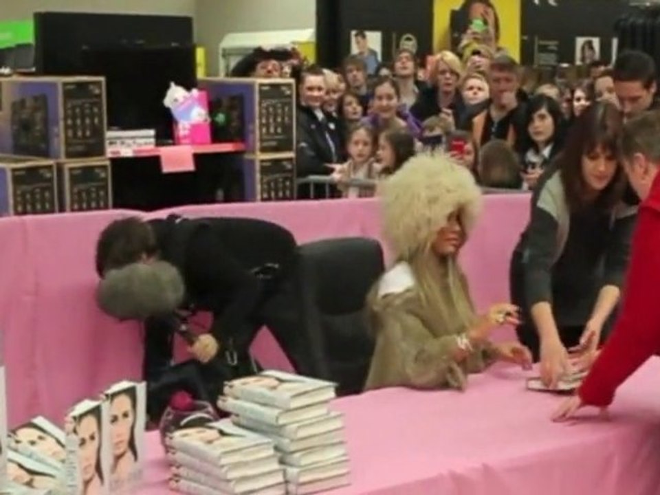 Katie Price wears furry hat for Asda book signing