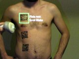 Scanning QR Code Tattoos with Video Mapping Interface