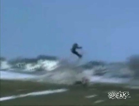 Ski jumper towed by a snowmobile = pretty good wipeout