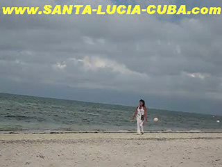 Cuban Girl Walking on the beach