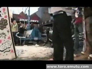 girl does half back flip on snowboard and lands head on pave