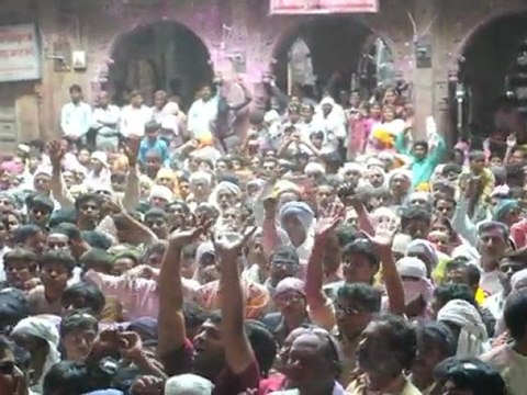 Indian Hindu devotees throw colours during Holi celebrations