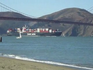 steam ship crossing under the Golden Gate Bridge