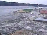 New footage of tsunami engulfing Japanese city
