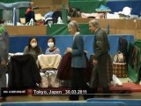 Japan's Emperor Akihito visits tsunami victims - no comment