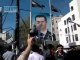 Syrian people tearing photos of  Bashar Al-assad.