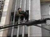 Dangling burglar rescued by firemen