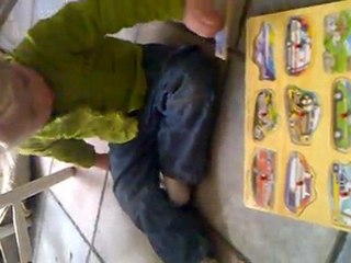 Mac plays with the new puzzle from Grandma & Grandpa Moore