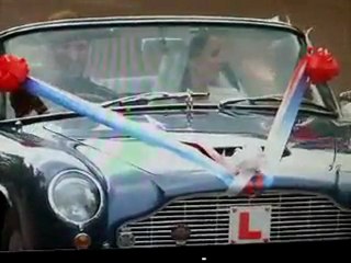 Prince William and Kate Middleton driving off in Aston Martin