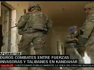 Télécharger la video: Talibanes e invasores luchan por control de Kandahar