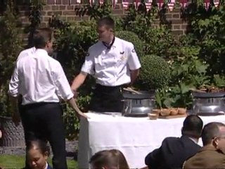 Obama flips burgers for troops