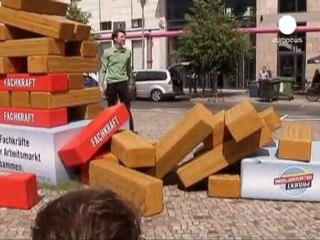 German unemployment down again in May