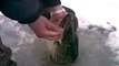 Russian Ice Fishing - bare handed!