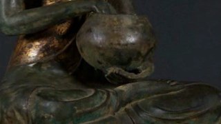 Seated Buddhist Monk Holding Alms Bowl