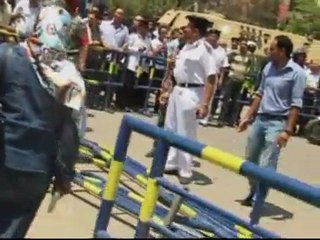 Egyptians protest by stoning police cars