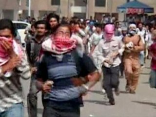 Pakistani police fire into air to break up protests