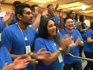 Die-hard fans flood Apple stores as iPhone 5 goes on sale