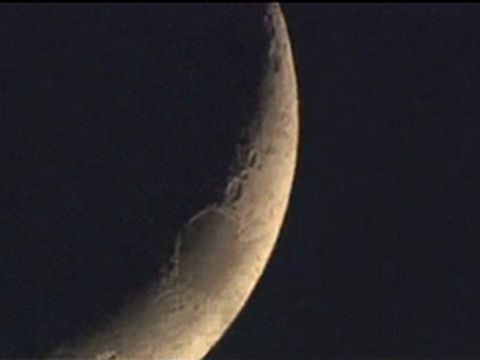 Moon crescent races across the sky