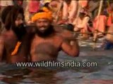 Naga sadhu taking bath in river Ganges