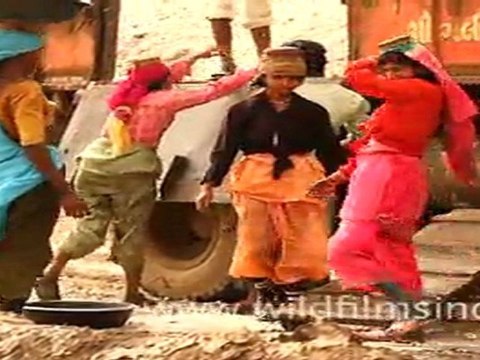workers loading salt into truck in Gujarat,India
