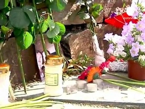 Flowers and candles for the dead on Utoeya island