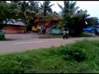 Truck wrecks while avoiding showoff motorcycle