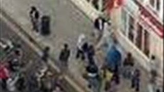 watch London Riot: Injured Boy Mugged By Passers