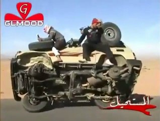 Guys change tires on moving car