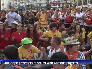 Anti-pope protesters face off with pilgrims in Madrid
