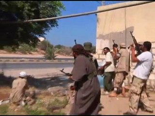 Presenter brandishes gun on Libyan TV