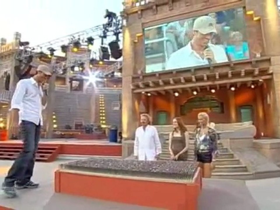 Enrique Iglesias laying on the bed of nails