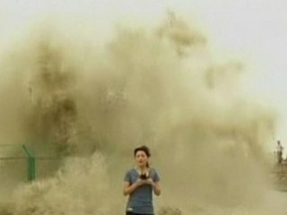 Chinese TV Journalist Gets Drenched by 70-Foot-High Wave