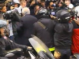 DSK back to catcalls and cheers