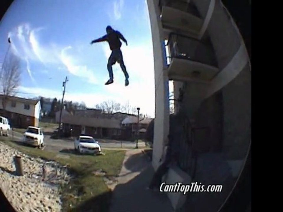Kid jumps off building onto volleyball court