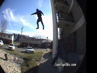 Kid jumps off building onto volleyball court