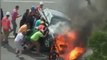 Bystanders Rescue Motorcyclist Trapped Under Burning Car