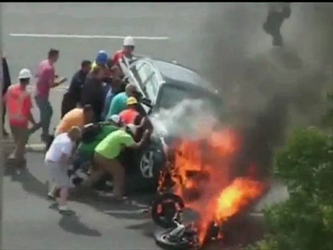 Bystanders Rescue Motorcyclist Trapped Under Burning Car