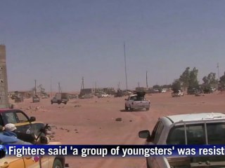 Convoy near Kadhafi hometown under fire