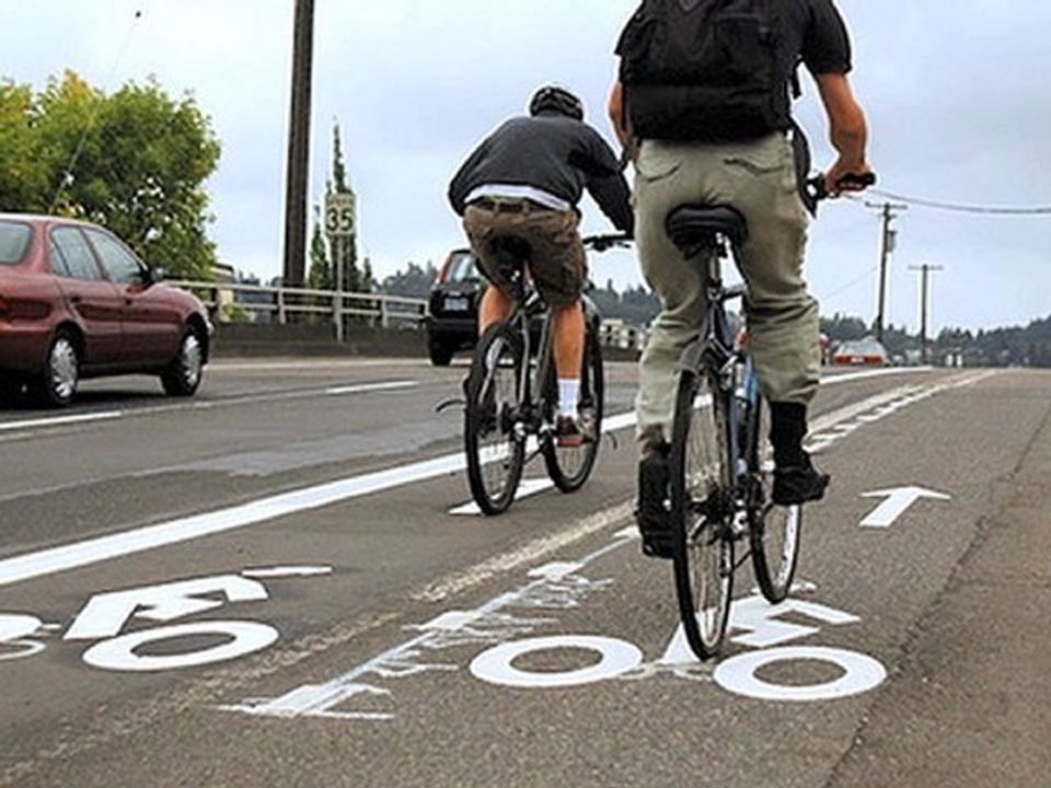 Do bicyclists have to stay as far to the right as possible?