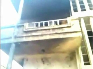 Gunfire on the streets in Rastan, Syria