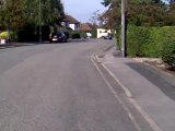 AC Cobra Driving Down Street