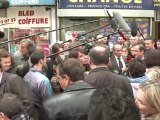 Visite de François Hollande sur un marché du 18ème à Paris