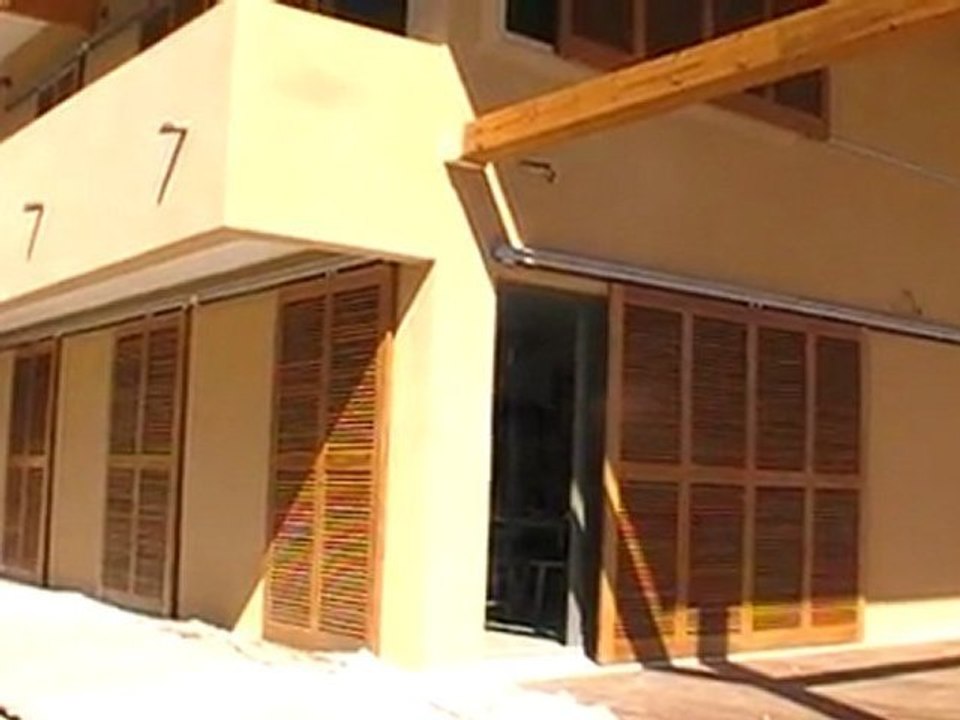 volets persiennes coulissant en bois exotique