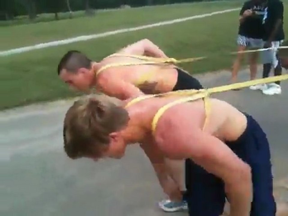 Shirtless Wrestlers Pull Fire Truck