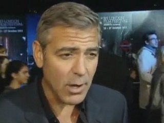 Clooney talks world affairs on the red carpet.
